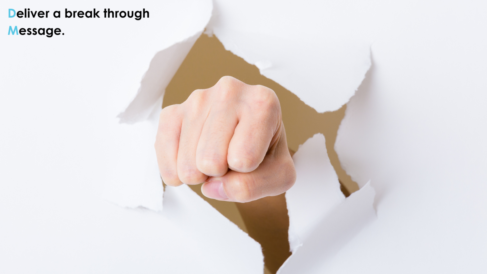 A fist is punching through a white paper background, symbolizing breaking through barriers. The text in the top left corner reads "Deliver a break through Message," with the letters "D" and "M" highlighted in blue to emphasize "Direct Mail." The image conveys the idea of a powerful, impactful message being delivered through direct mail or print advertising.